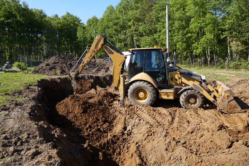 Excavator preparing land for construction
